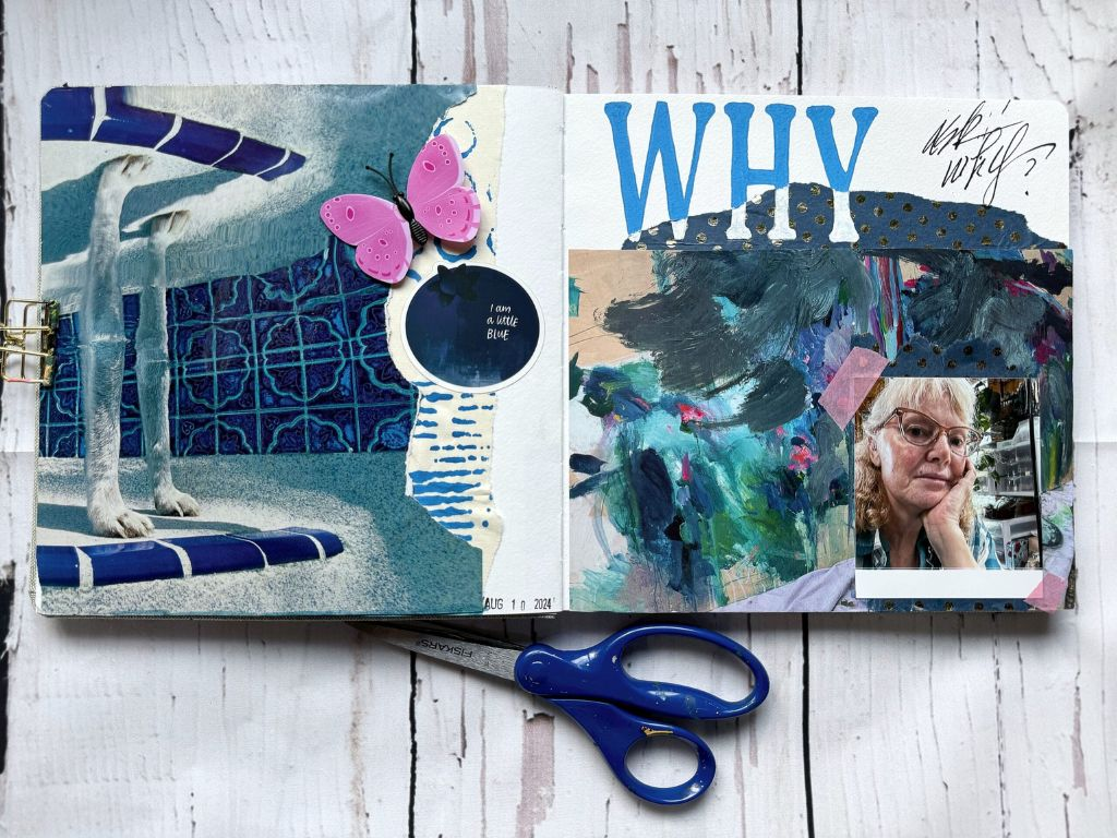A Photo of an art journal double page spread in blues with a dash of a pink butterfly and the words Why ask why?