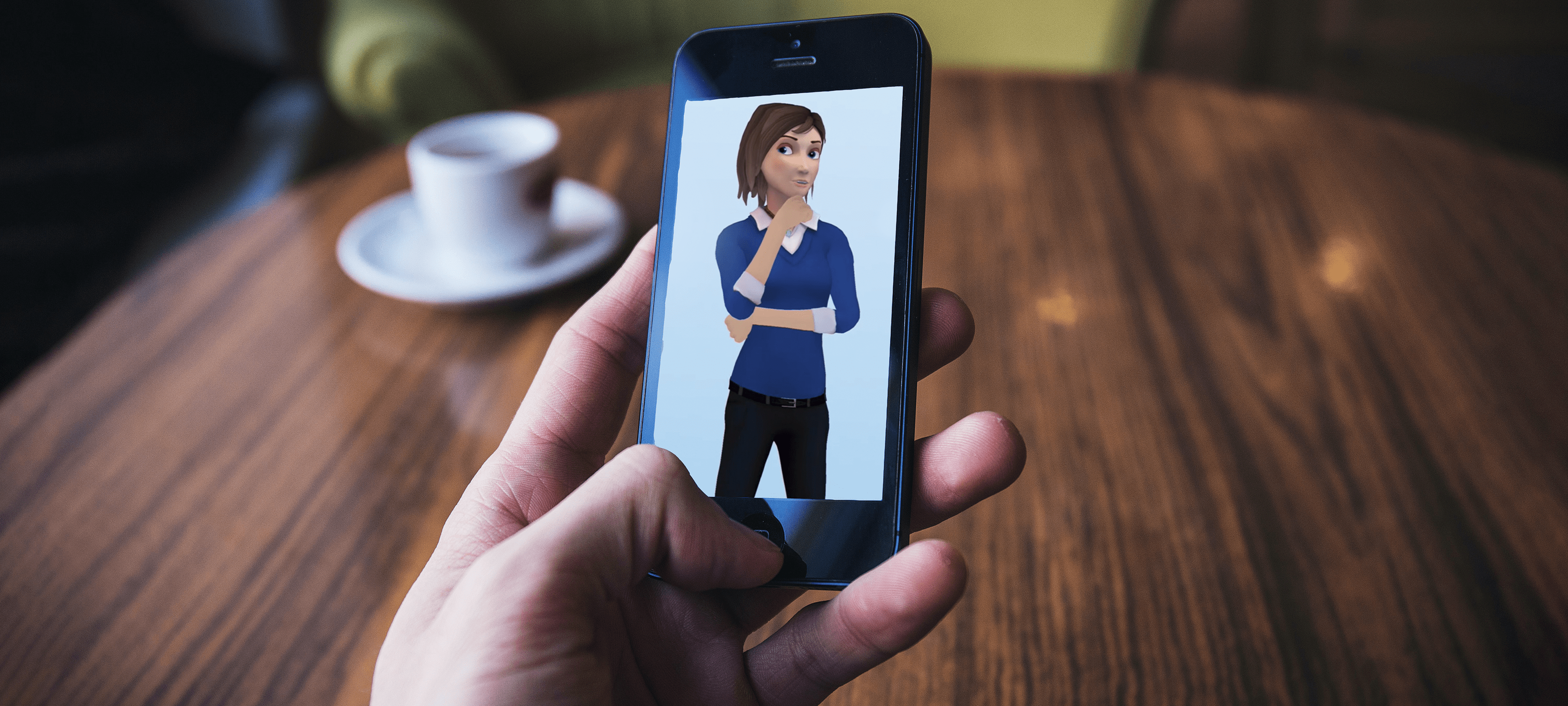 Hand holding a smartphone with Diabetes Coach app on the screen