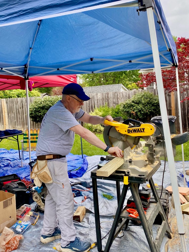 photo of man and table saw.
