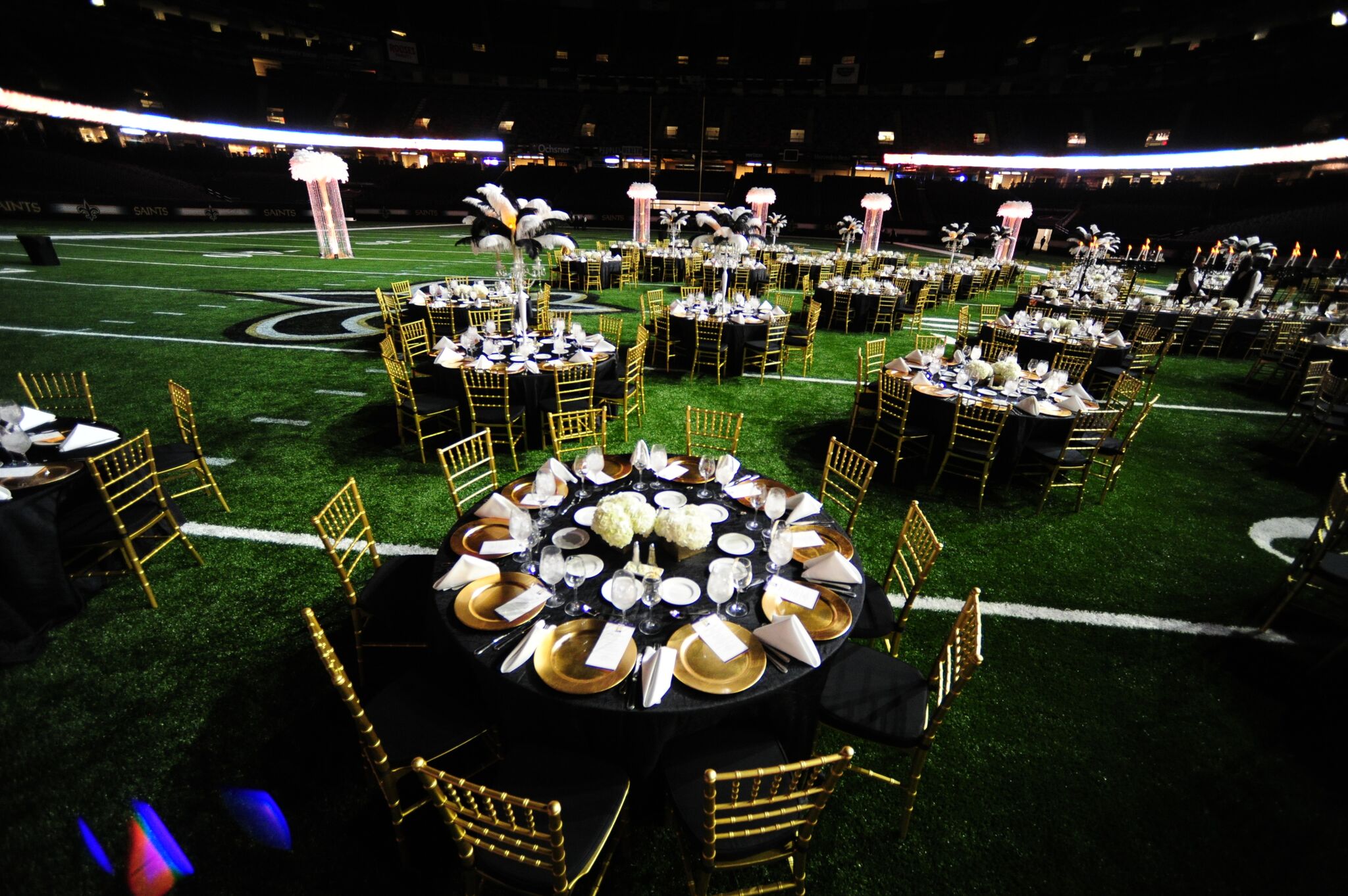 Elegant table setup on a field for a high-profile corporate event
