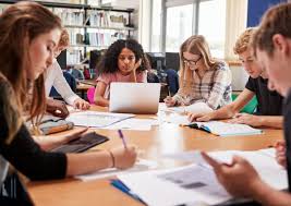 Students in a library setting working together