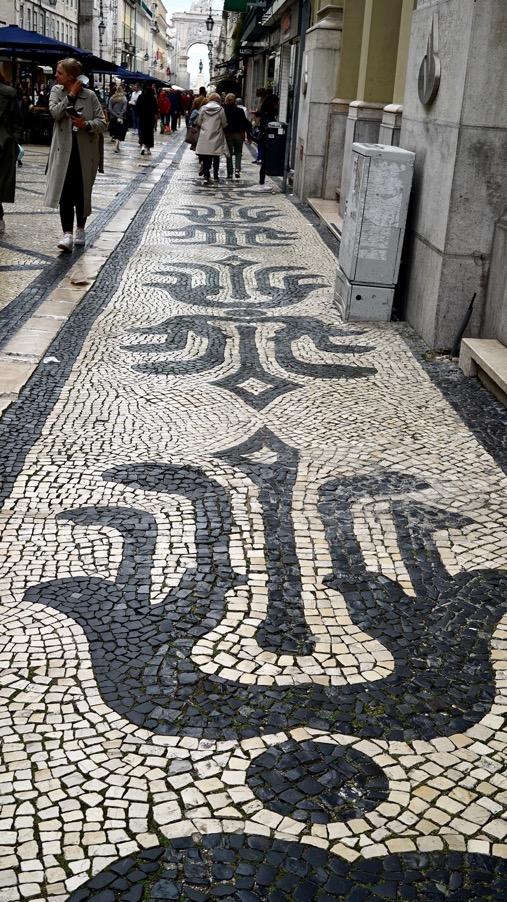 Sidewalk with heraldic symbols