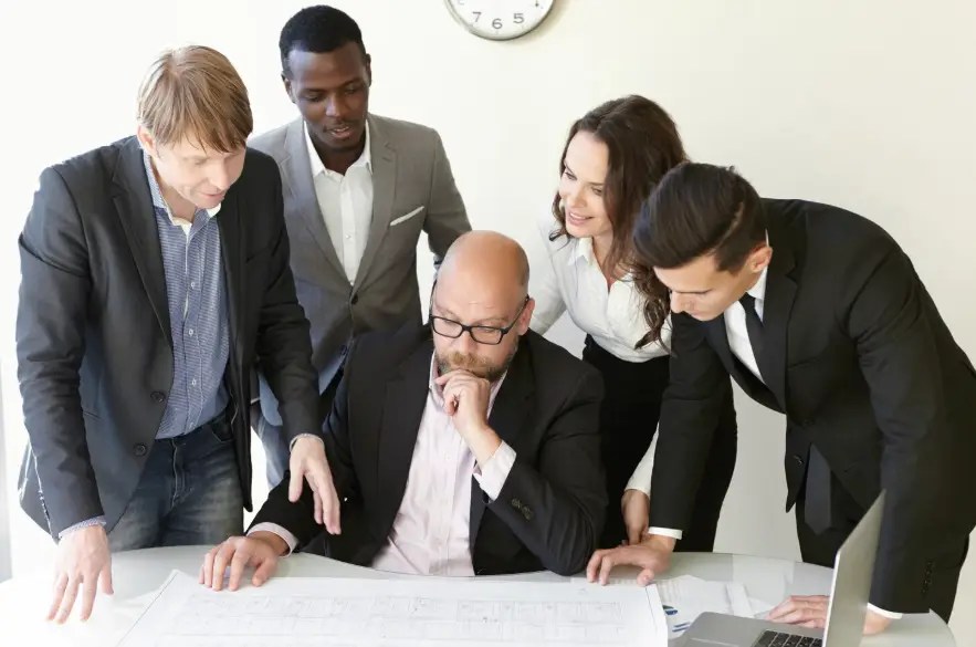 Group of engineers working on plan