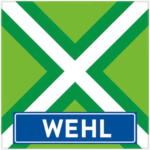 Plaatsnaambord met de tekst "WEHL" in witte hoofdletters op een blauwe balk. Daarboven een vlag met lichtgroene achtergrond, een helder wit St. Andrieskruis gecentreerd in een donkergroen kruispatroon — volledig volgens het originele vlagvoorbeeld, formaat 600x600.