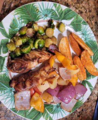 Grilled Pineapple Chicken and Vegetables, Maple Glazed Brussel Sprouts, and Paprika Potato Wedges
