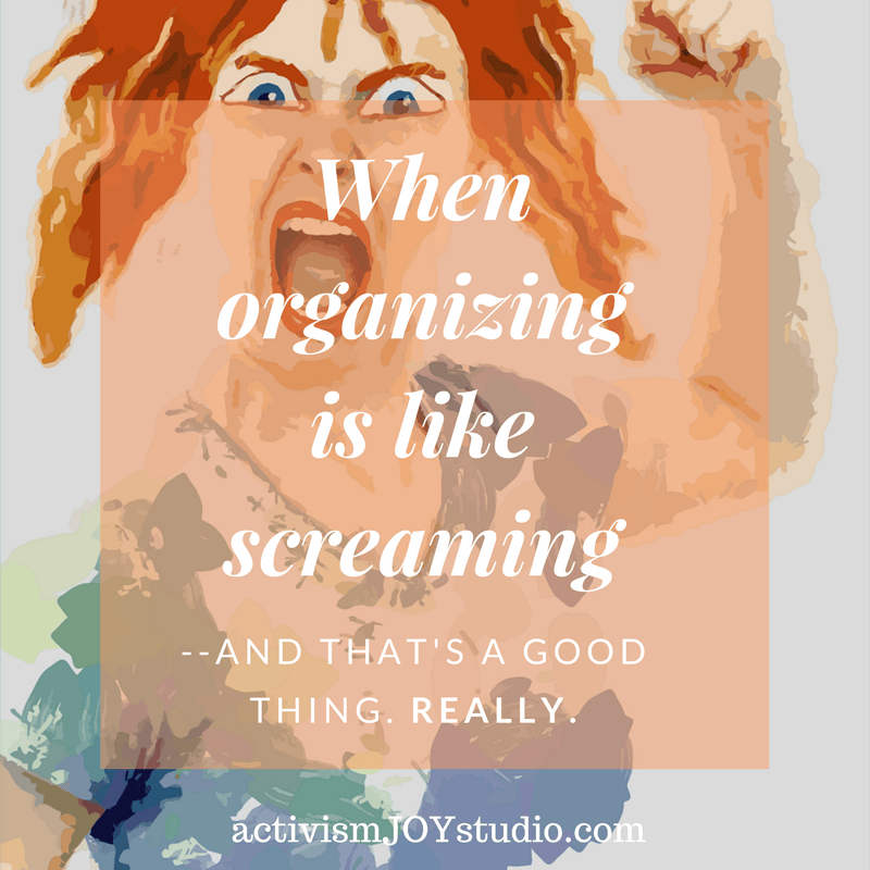 red-haired woman screaming and raising her fist