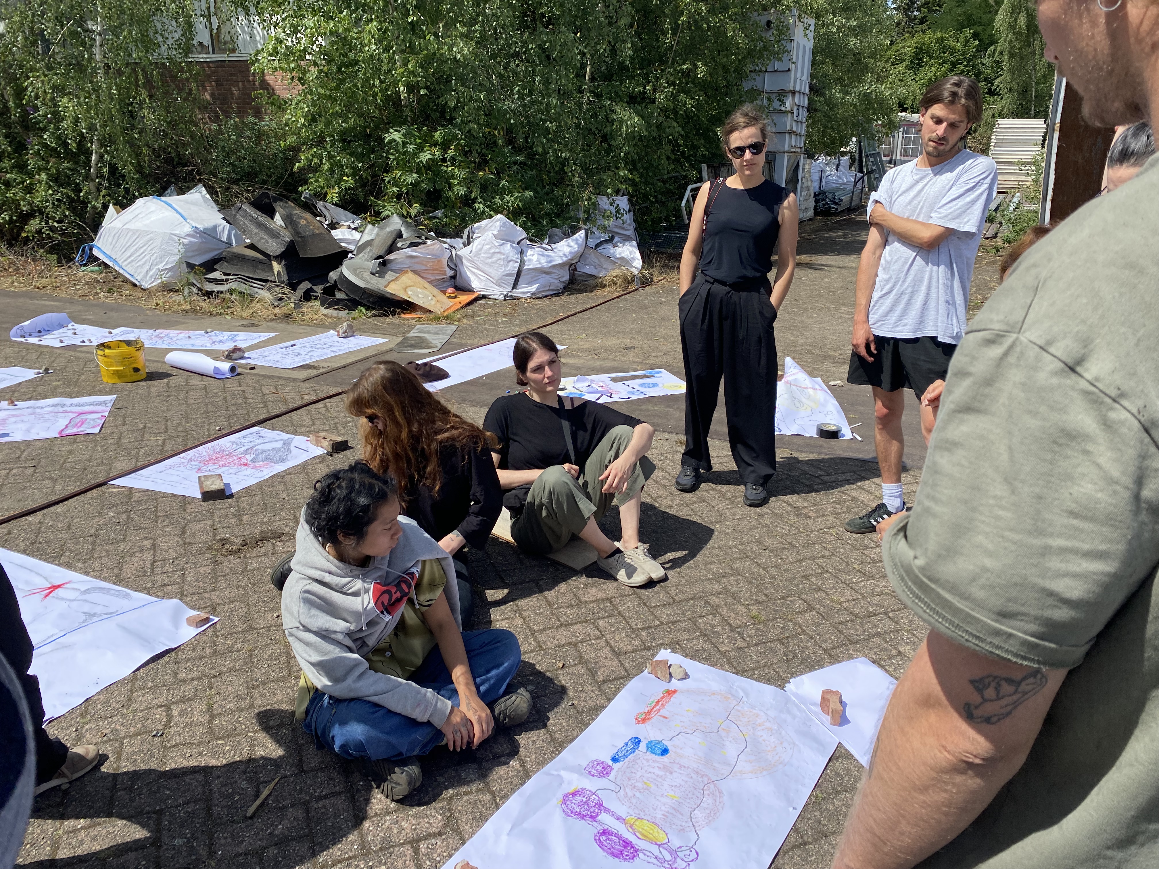 Artists Adam Moore and Lotte Van Gelder facilitating drawing, writing and spaeking with site at Destination Unknown 2023 © Adam Moore.