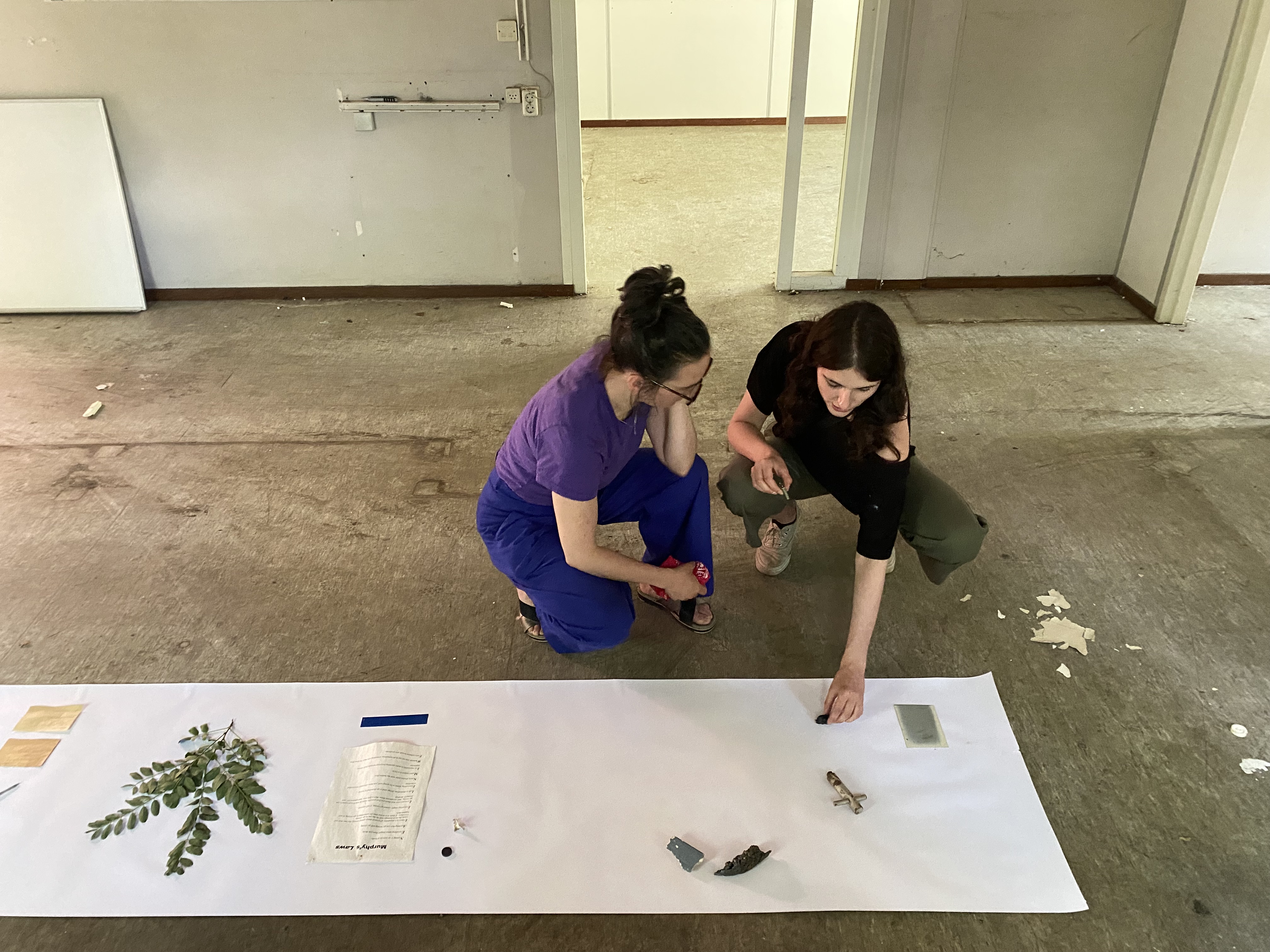 Artists Adam Moore and Lotte Van Gelder facilitating curating with site with Destination Unknown 2023 artist Juliana Zepka © Adam Moore.