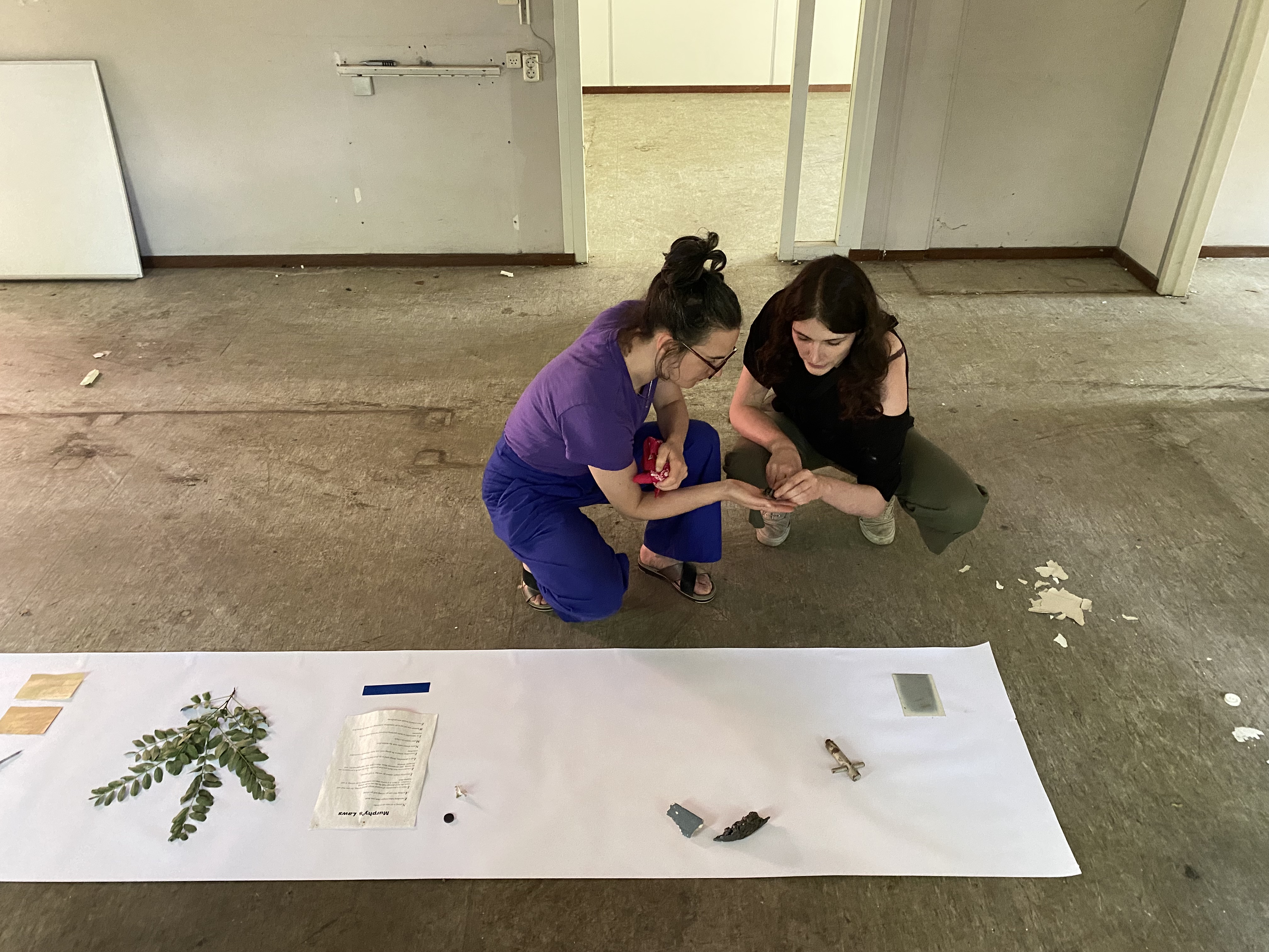 Artists Adam Moore and Lotte Van Gelder facilitating curating with site with Destination Unknown 2023 artist Juliana Zepka © Adam Moore.