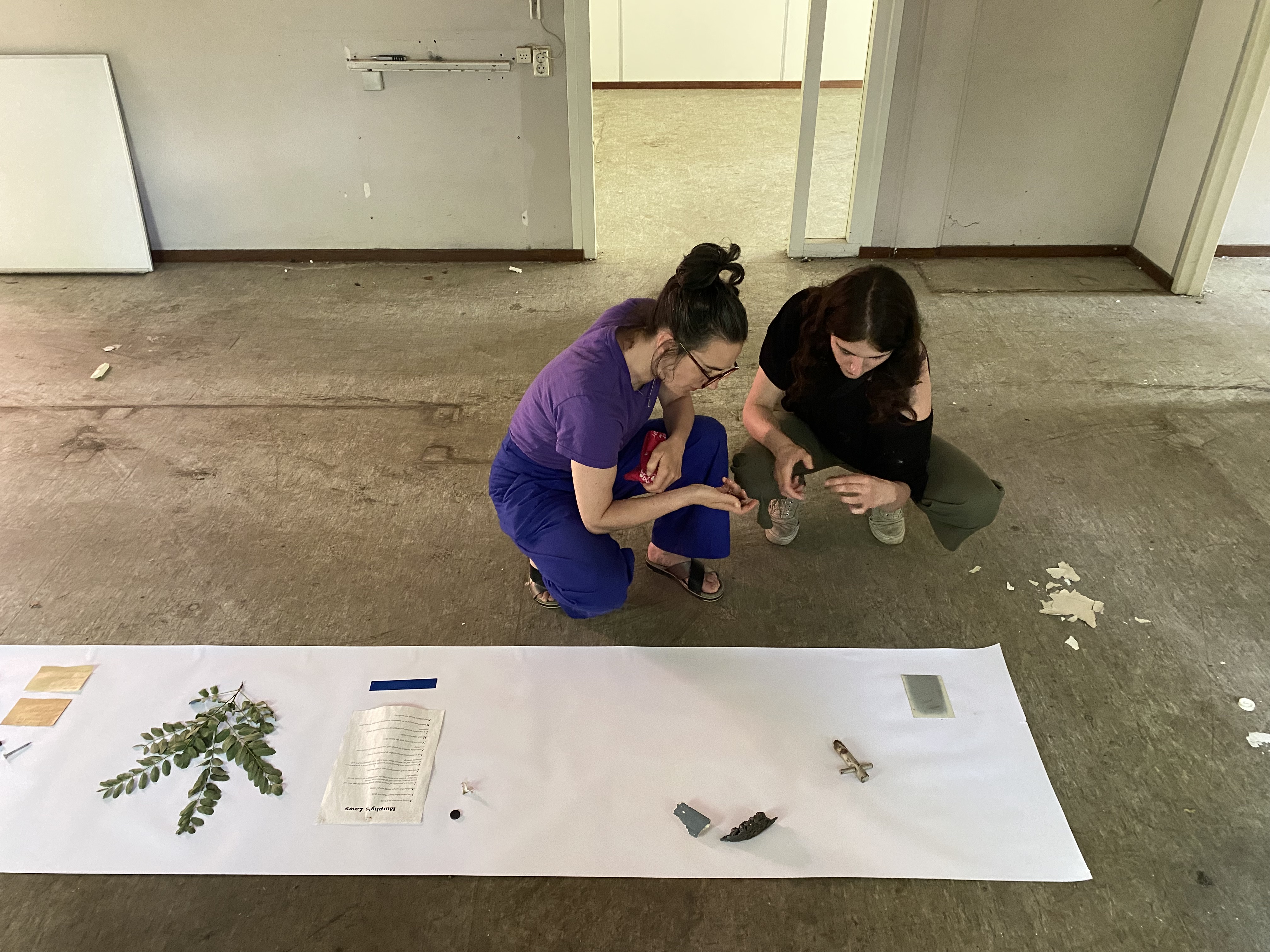Artists Adam Moore and Lotte Van Gelder facilitating curating with site with Destination Unknown 2023 artist Juliana Zepka © Adam Moore.