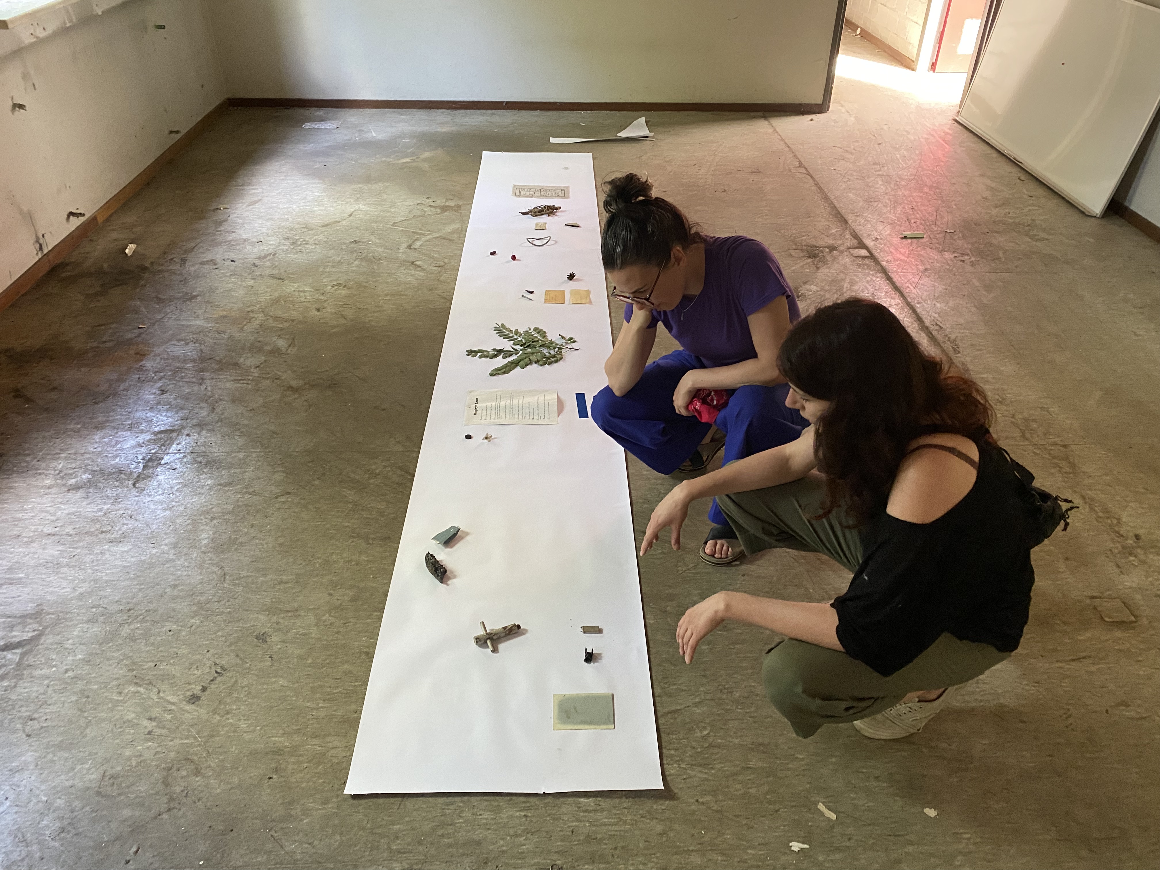 Artists Adam Moore and Lotte Van Gelder facilitating curating with site with Destination Unknown 2023 artist Juliana Zepka © Adam Moore.
