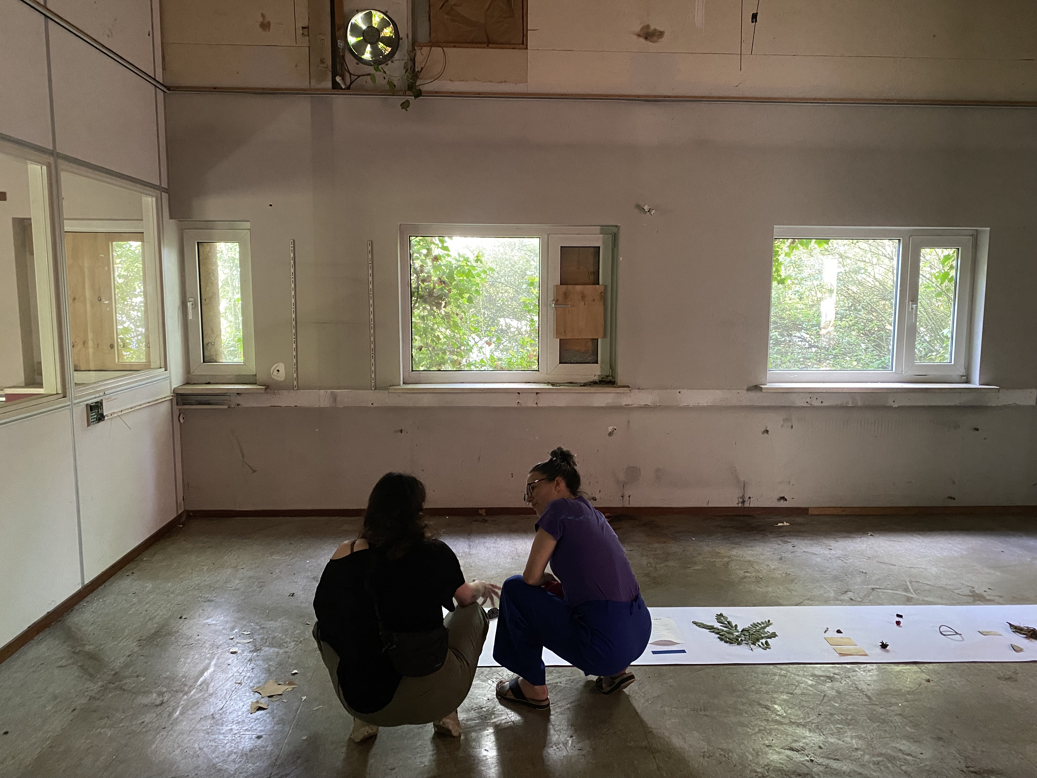 Artists Adam Moore and Lotte Van Gelder facilitating curating with site with Destination Unknown 2023 artist Juliana Zepka © Adam Moore.