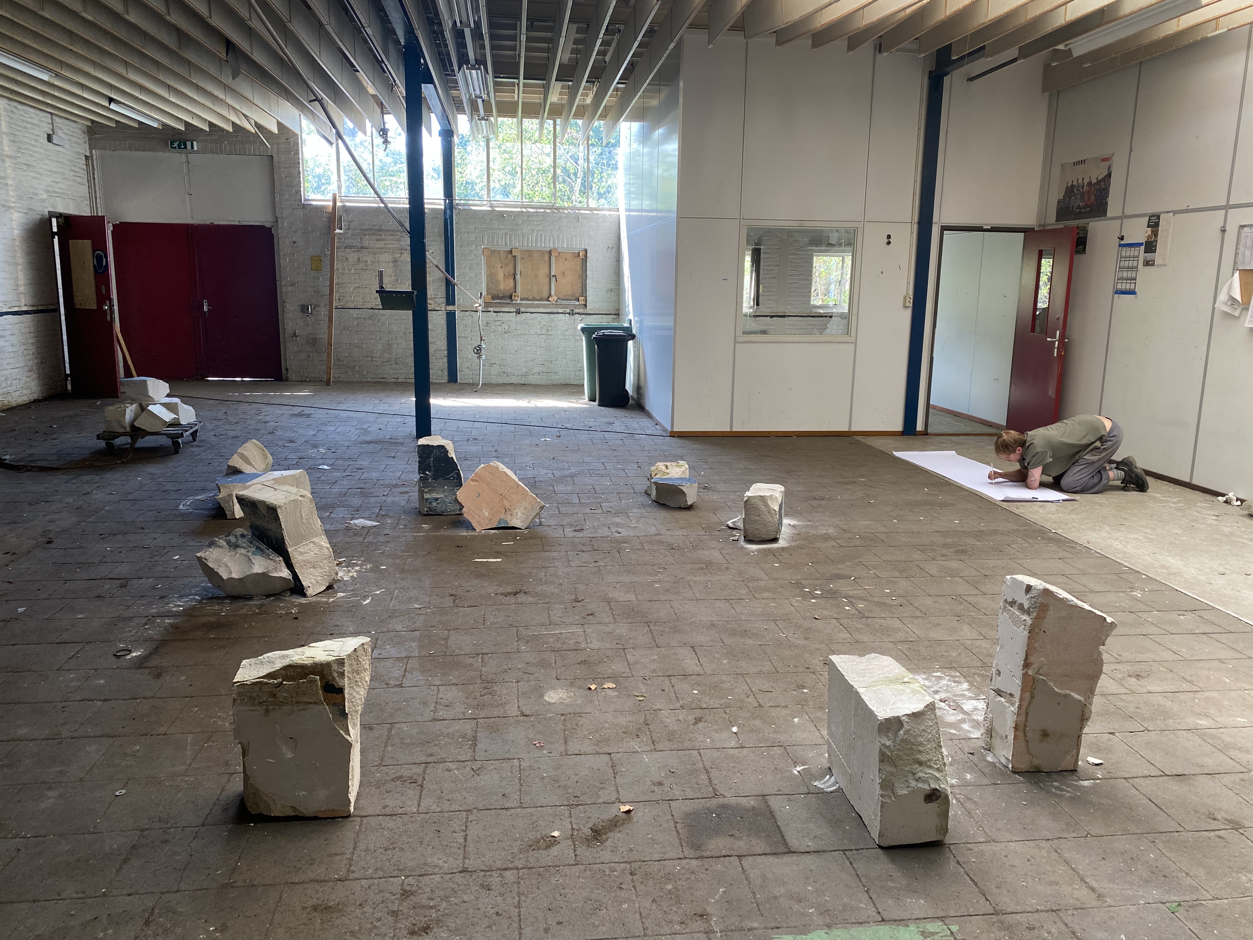 Artists Adam Moore and Lotte Van Gelder facilitating curating with site with Destination Unknown 2023 artist Sjors Smit © Adam Moore.