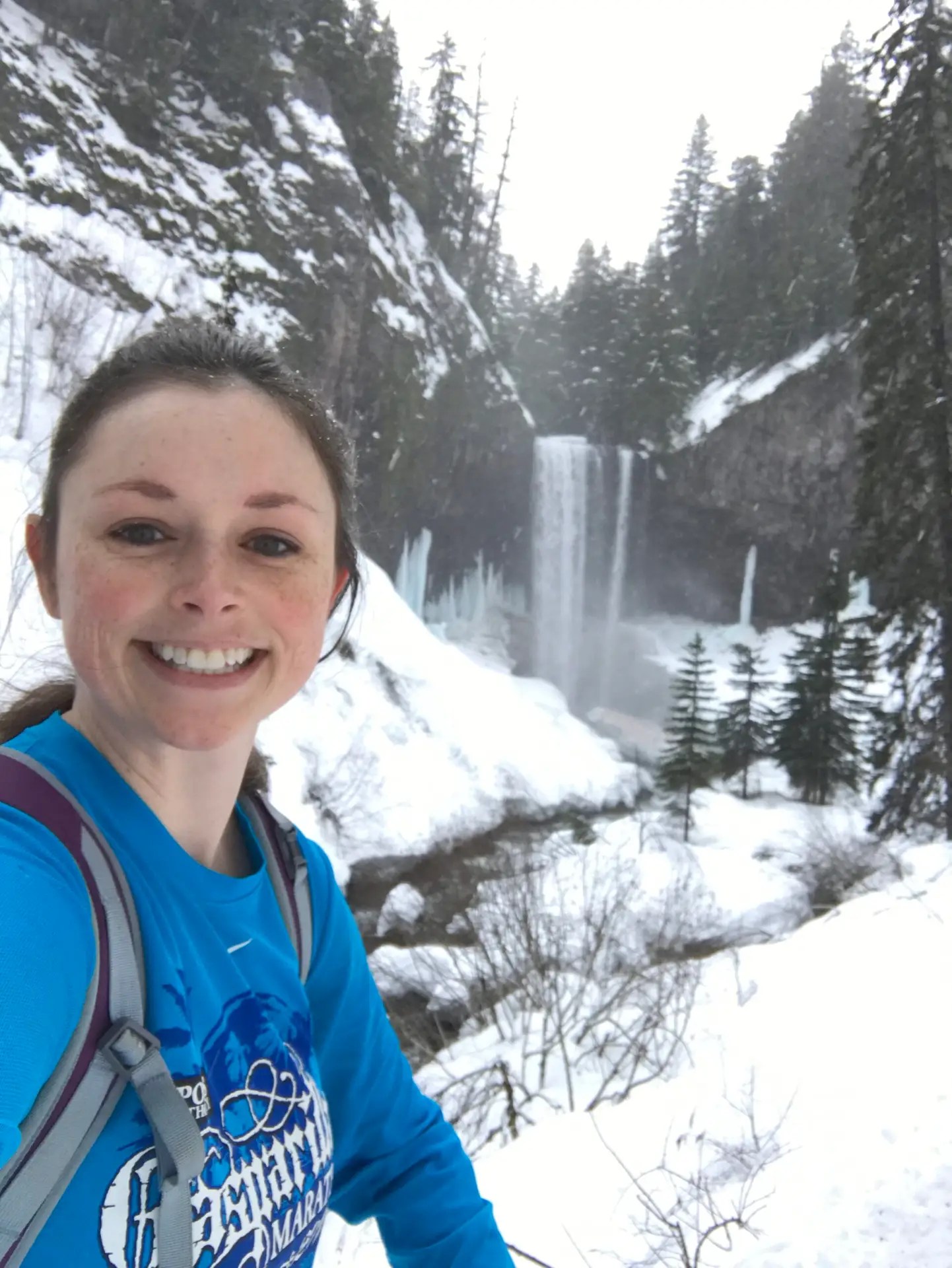picture of Ashley, a trauma-focused therapist for complex trauma in portland oregon outside on a winter hike in the snow