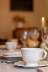 white tea cup and saucer