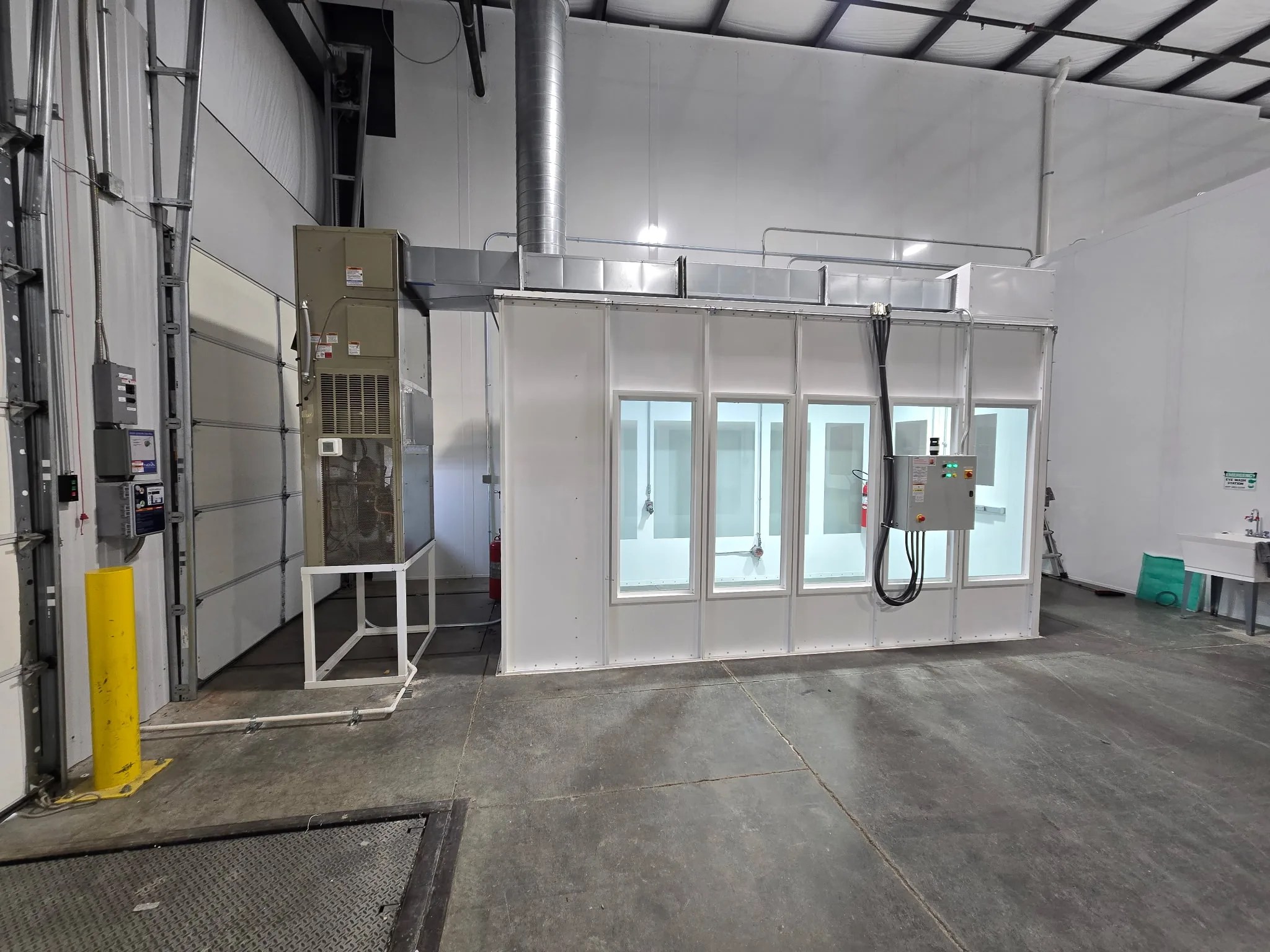 Indoor hazardous location enclosure with glass viewing panels and air conditioning