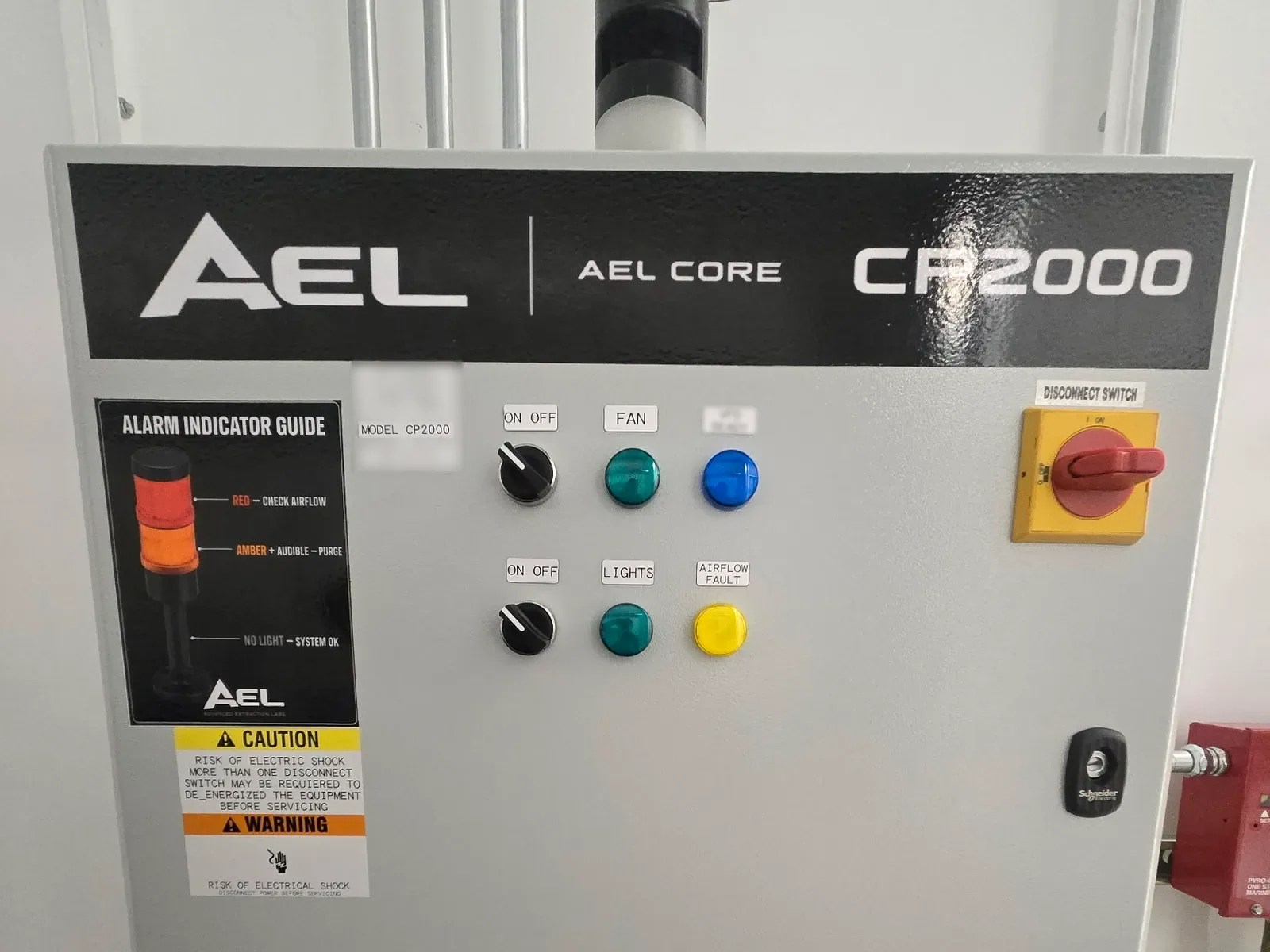 AEL CP2000 control panel door with status indicator lights, selector switches and an emergency stop