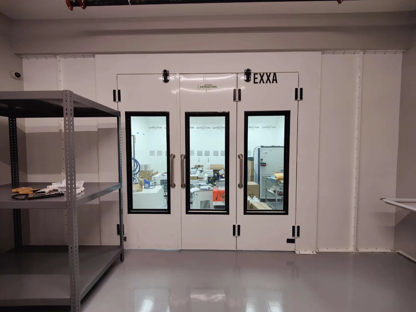 AEL EXXA booth with three windowed doors installed inside a building