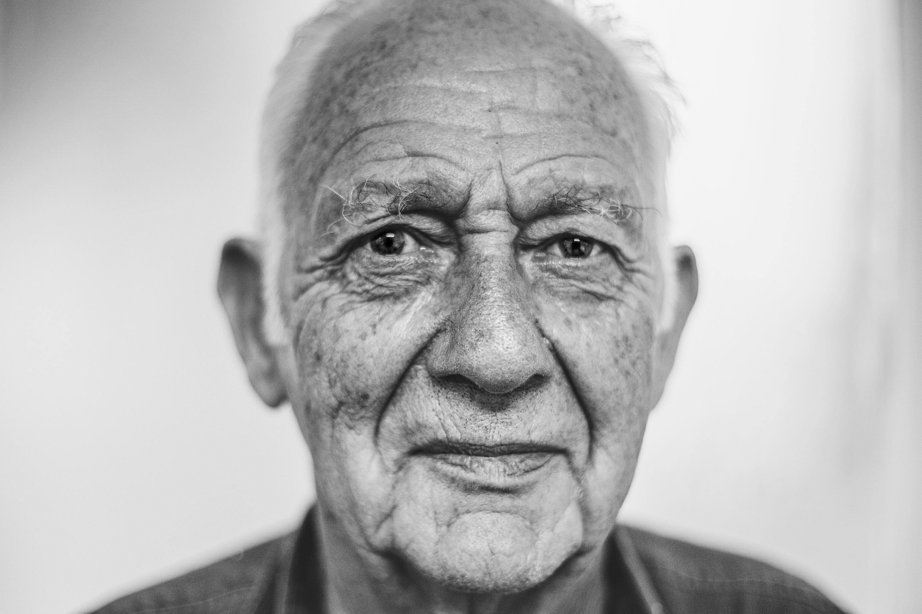 Headshot portrait of elderly man.