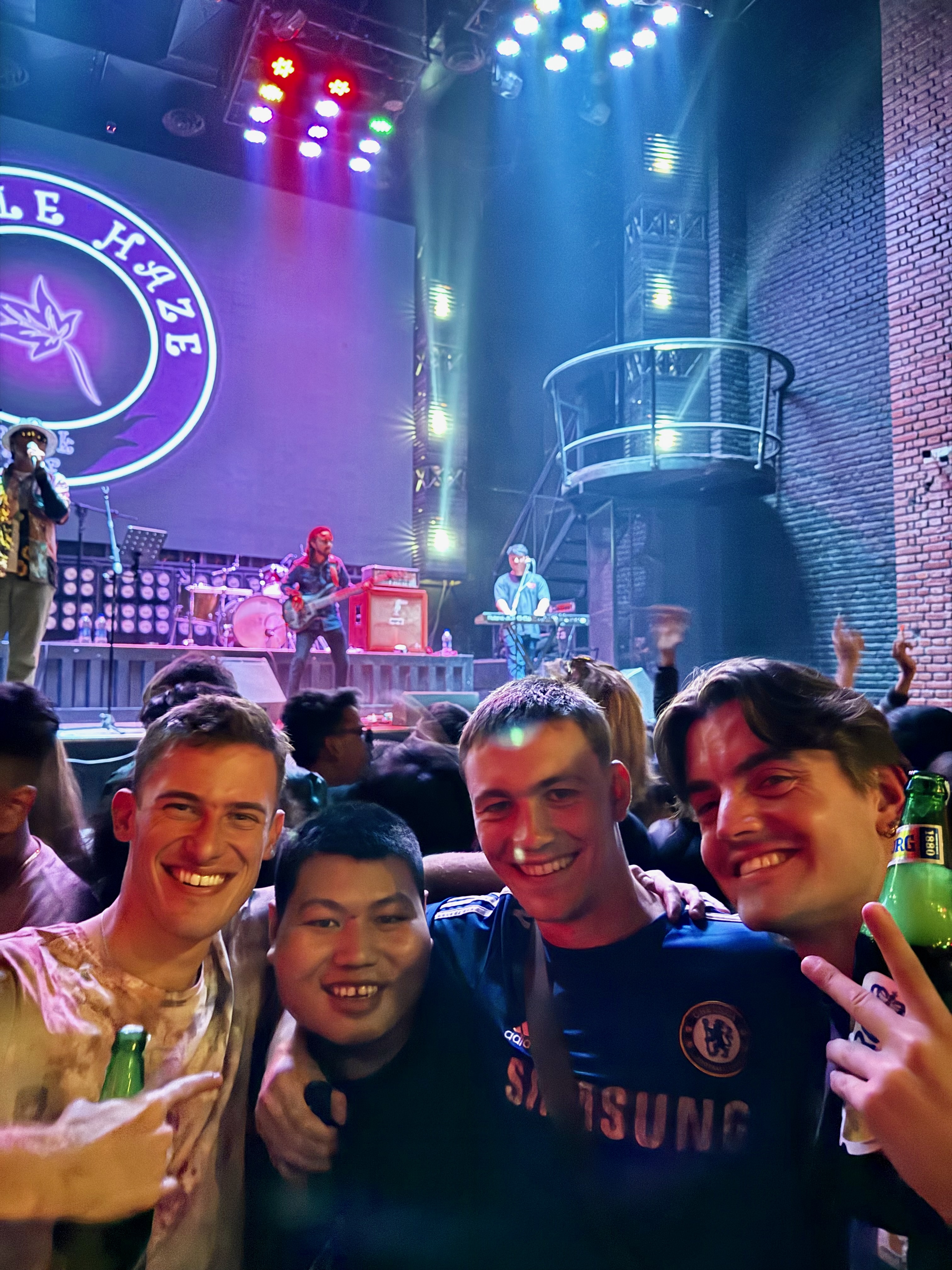 Friends enjoying drinks and dancing at Purple Haze in Kathmandu