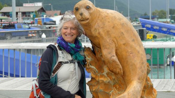 Wendy poses with carved seal sculpture