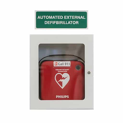 Red defibrillator in wall cabinet