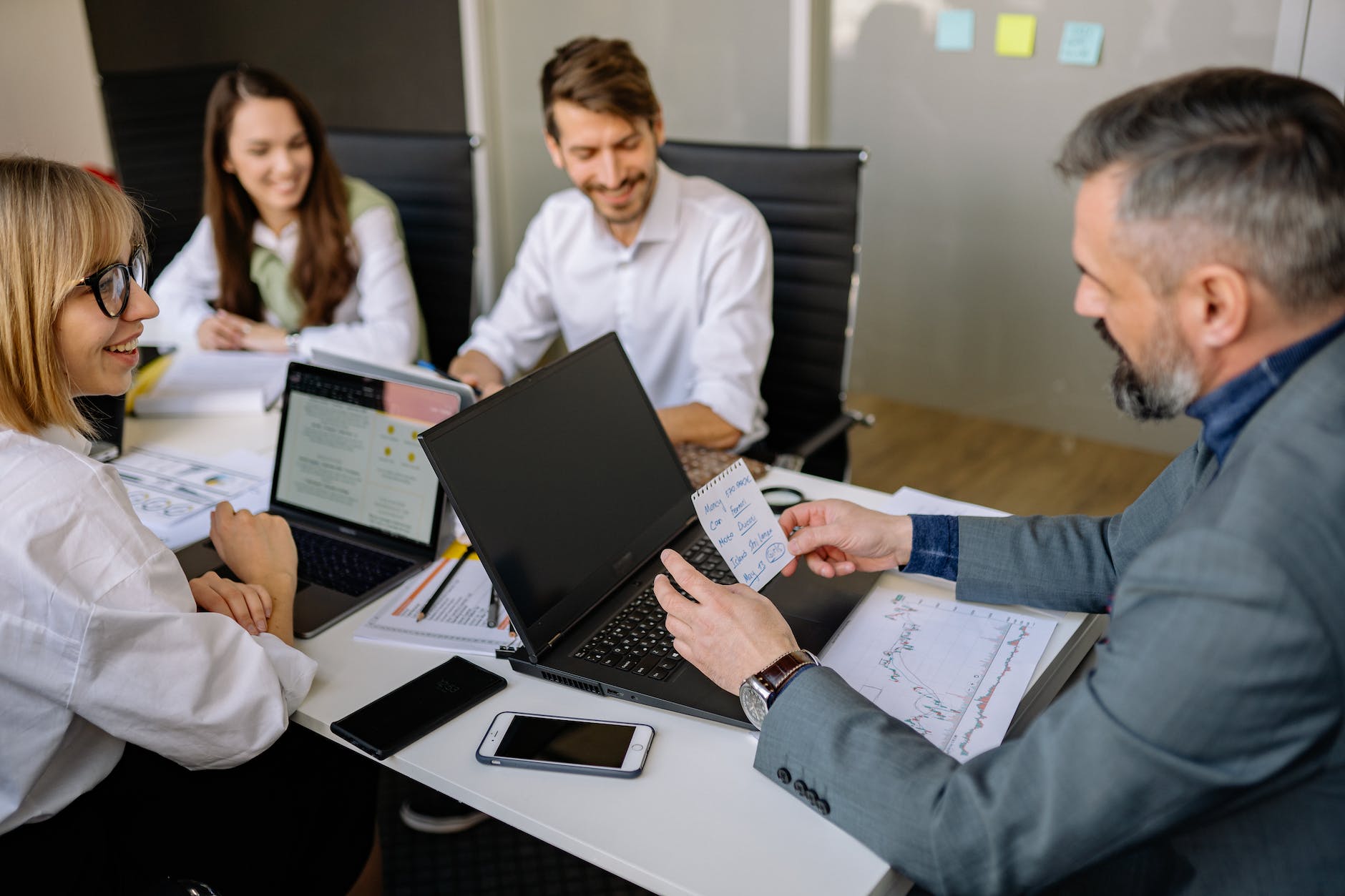 employees happily having a meeting with their boss