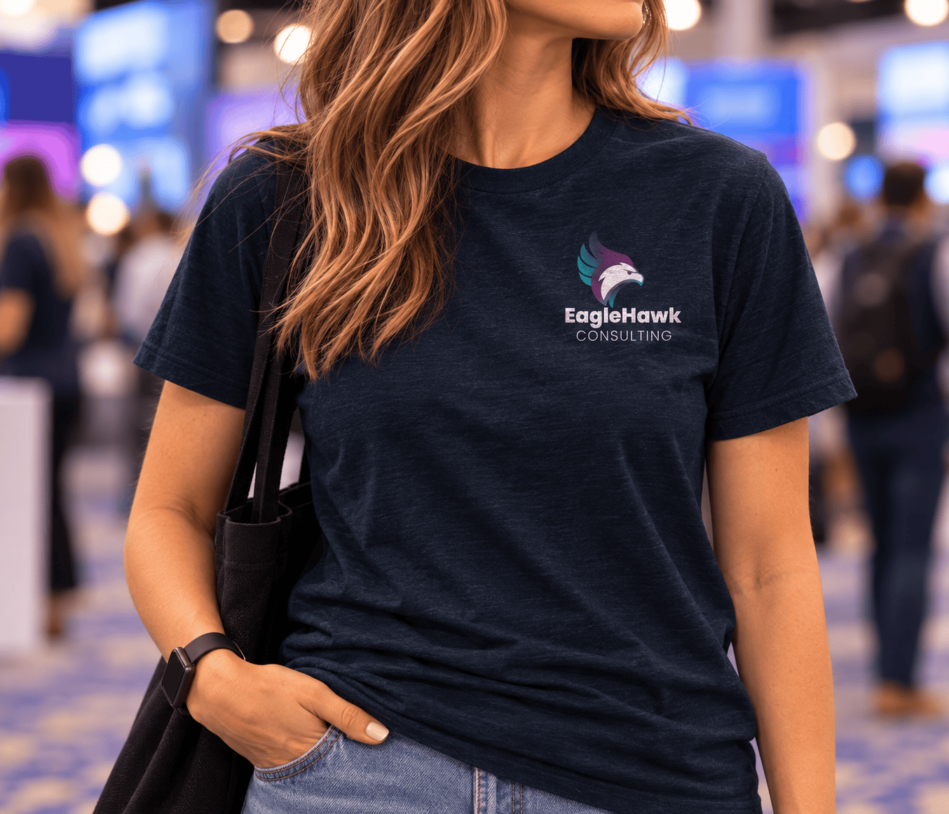 EagleHawk Consulting front view of a person wearing a navy branded t-shirt