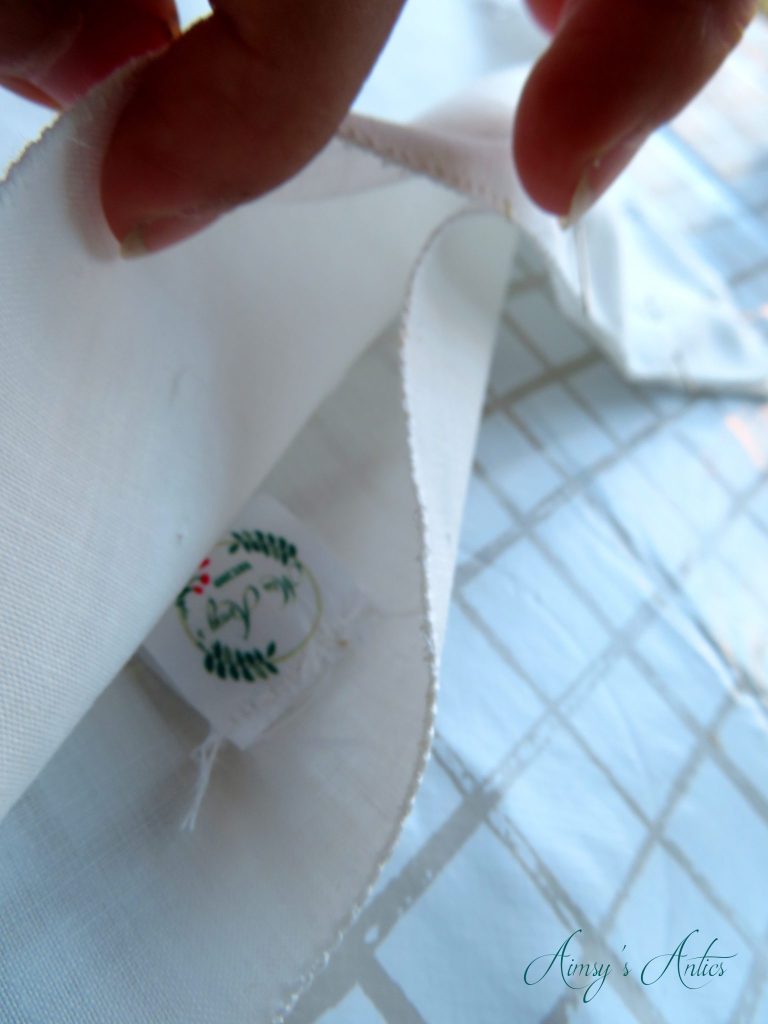 Adding a label into the side seam of the cushion