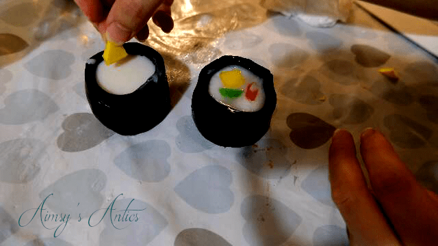 Adding coloured pieces of soap to the sushi roll soap