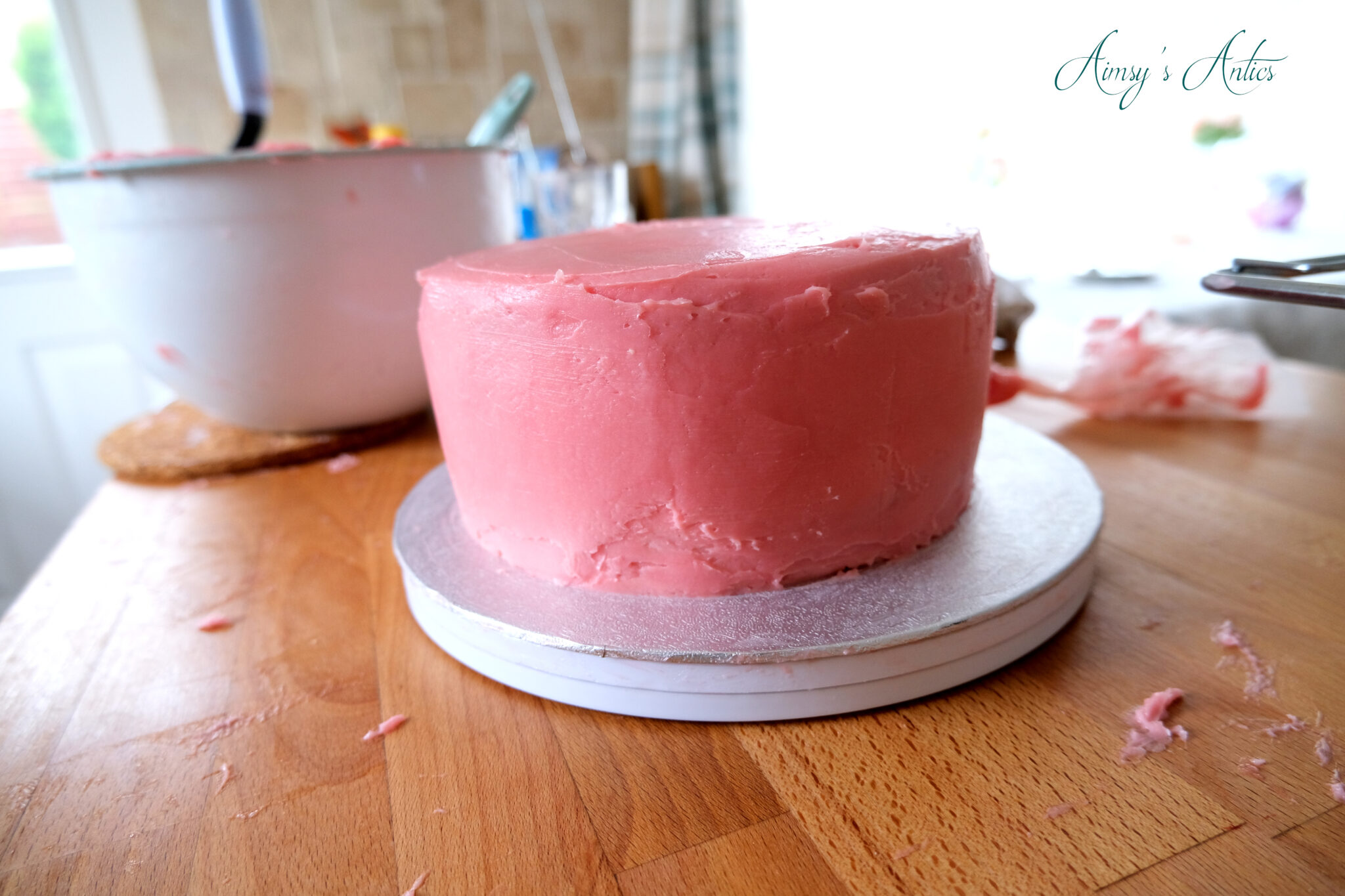 Smoothing the buttercream onto the cake