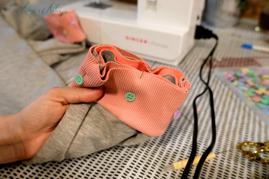 Ankle cuffs pinned to the joggers legs