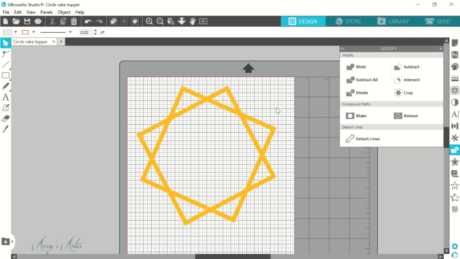 Placing the two squares to create the frame of the cake topper