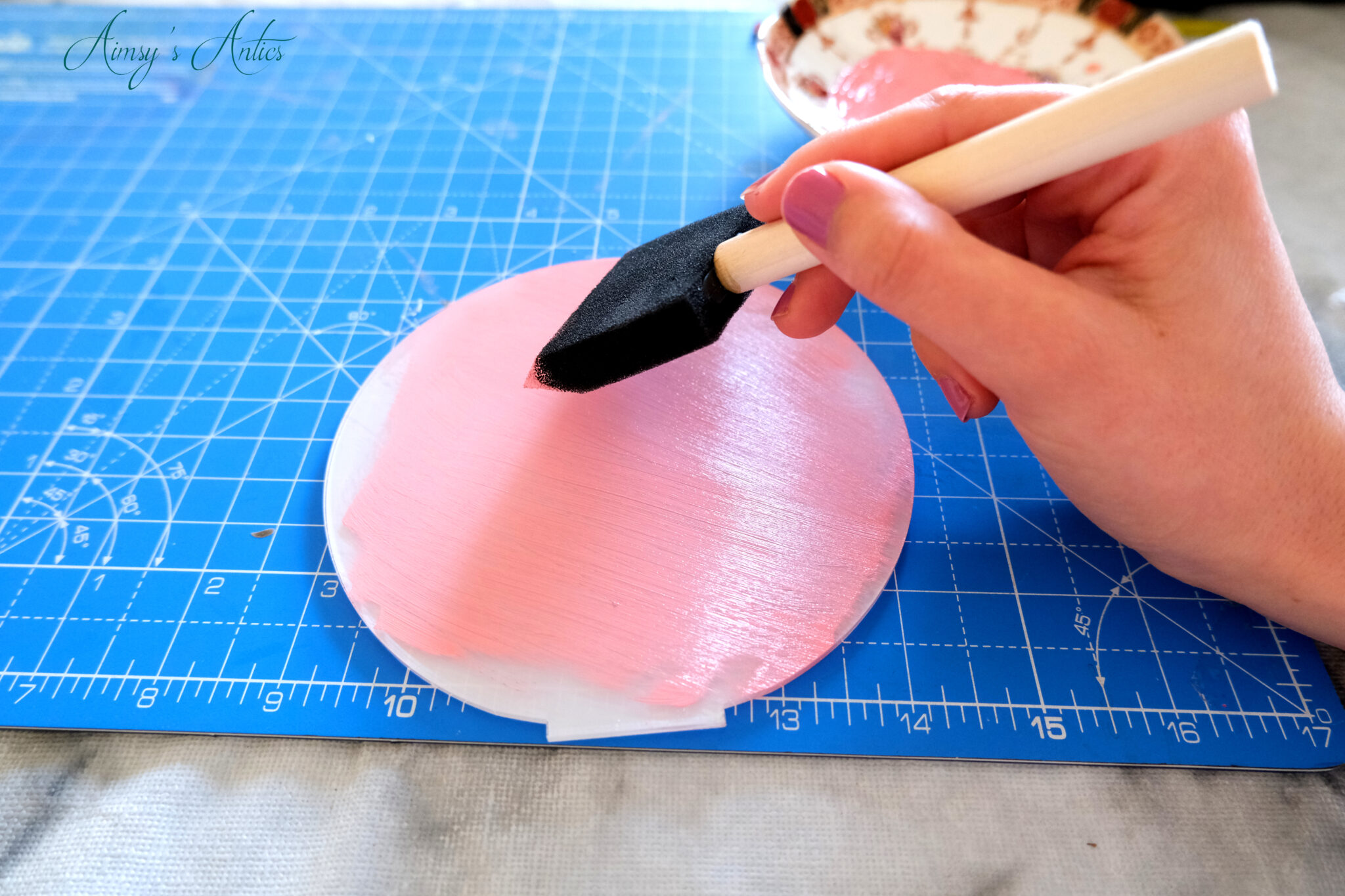 Applying paint to the acrylic sign blank