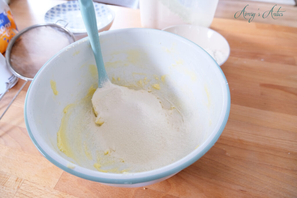 Adding the flour into the shortbread mix