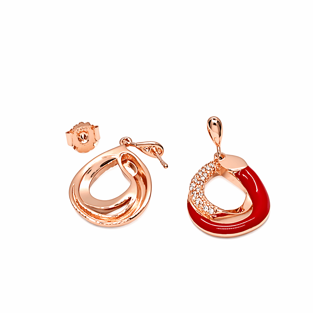 Enchanted Orbits Earrings shown front and back; 925 silver in rose gold and champagne gems with red enamel, textured pavé, and sculpted open design.