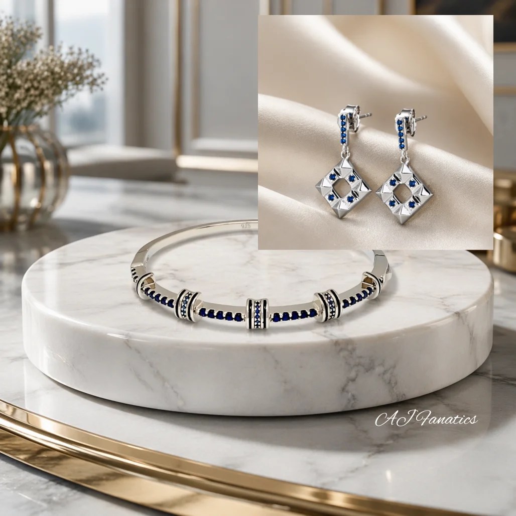 silver bracelet and earring gift set – a sleek silver bangle and geometric drop earrings accented with deep blue sapphire stones, bringing modern elegance and refined sparkle to every occasion.