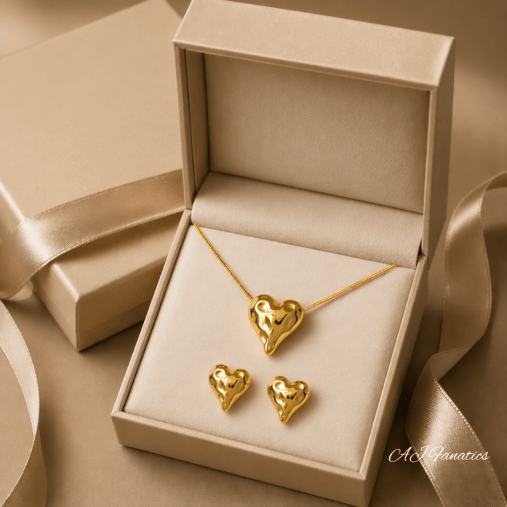 Melting Hearts Lustrous Heartbeats Gift Set – a fluid gold heart necklace with matching studs, beautifully presented in a luxe box, ready to say “you melt my heart.”