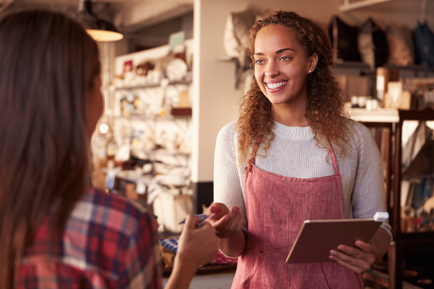 A beautiful woman serving a customer showcasing the benefits of Frontline Performance.
