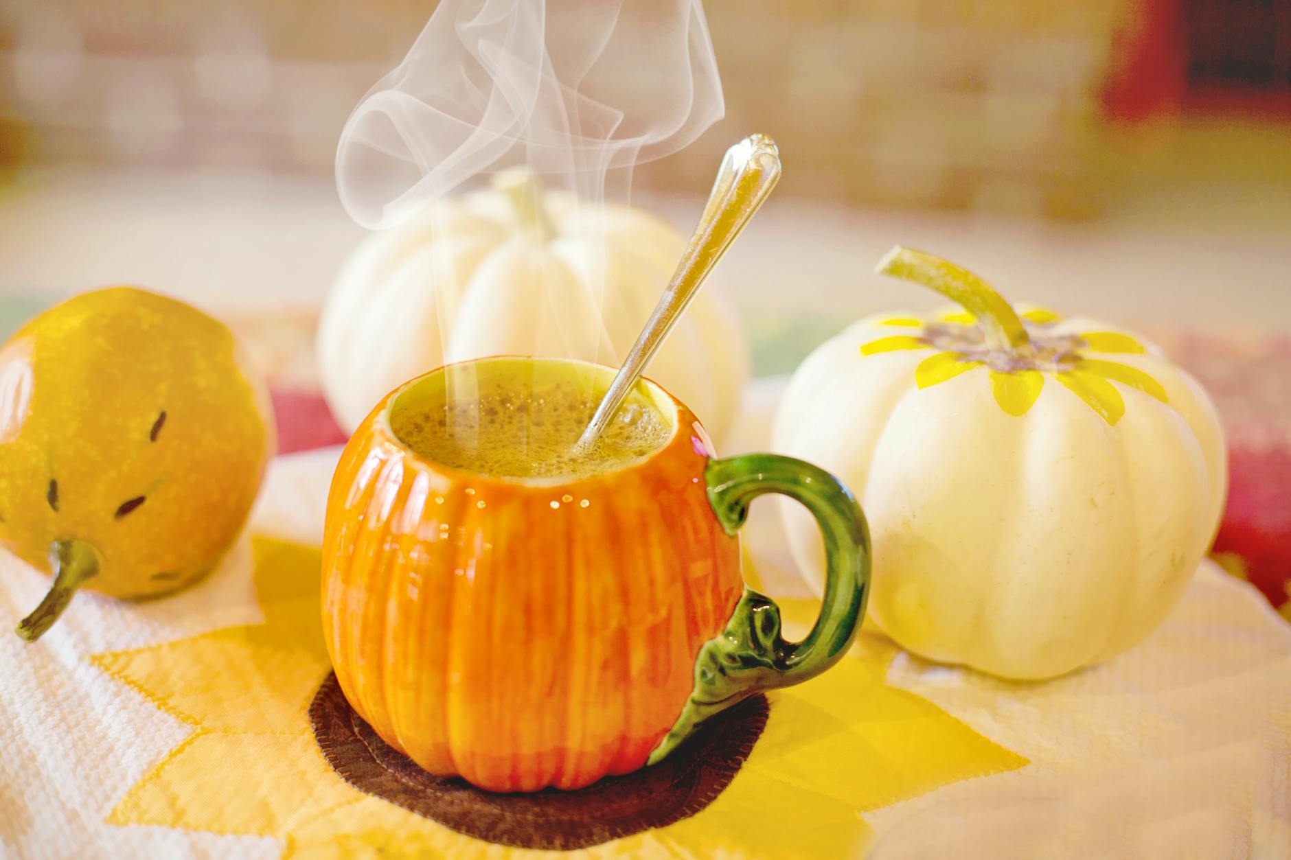 close up photo of a hot drink in an orange cup
