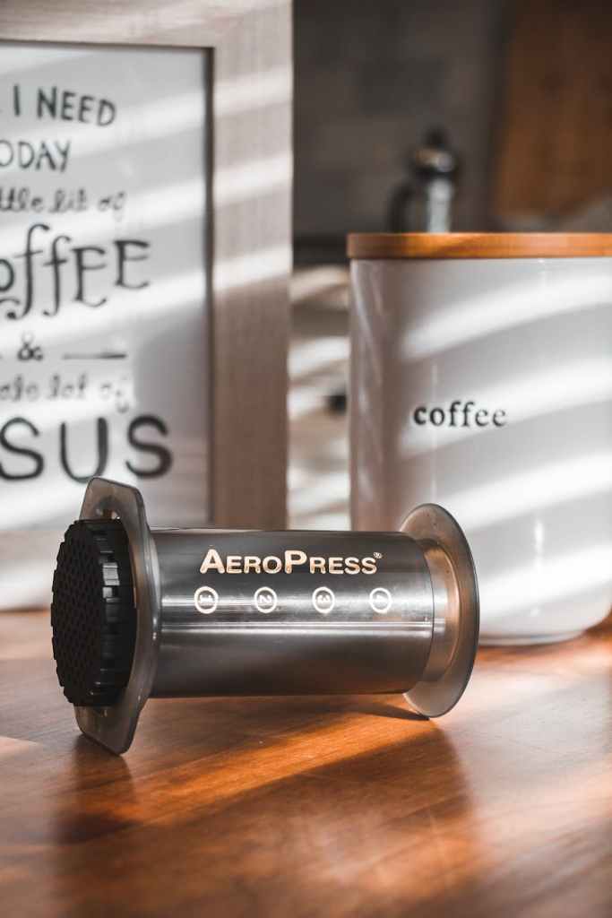black coffee press on wooden table