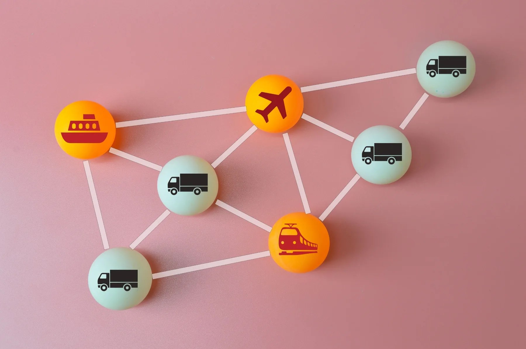 Diagram of a connected logistics network featuring ship, airplane, train, and truck transportation.