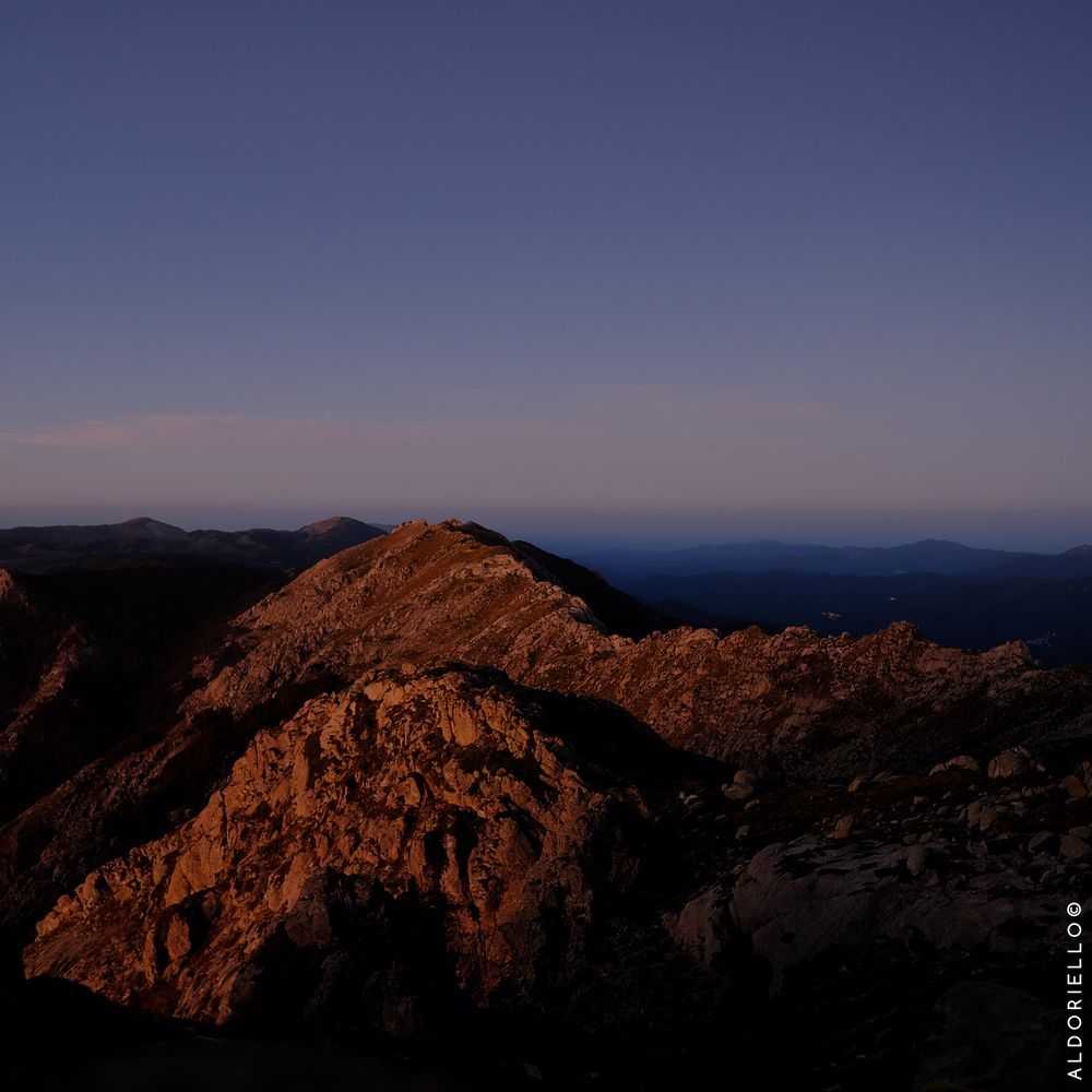 Dawn at Cima Fornicula with view on the village of Palneco