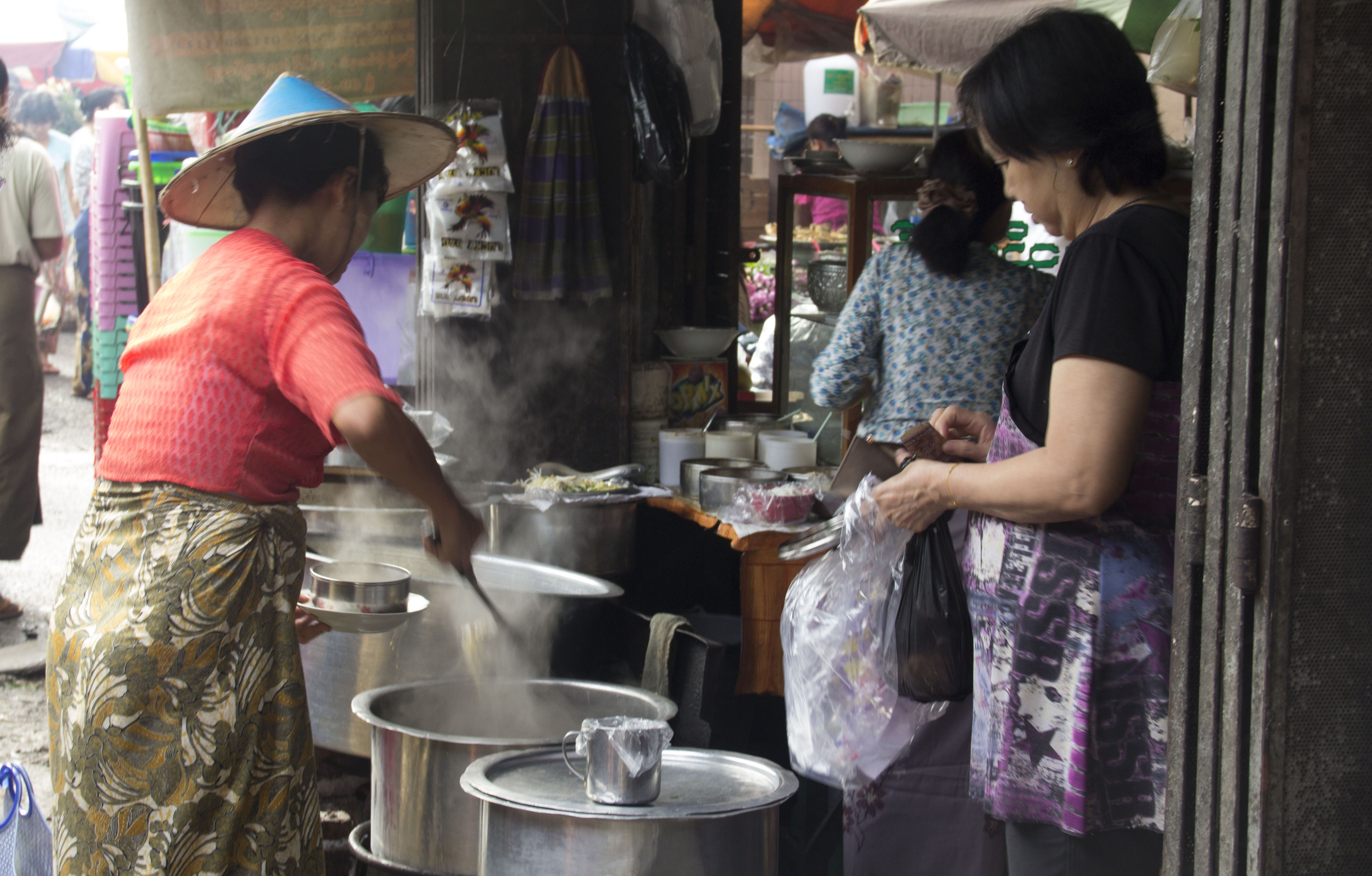 Woman selling soup at a morning wet market behind Aung Si Guest House (Ocean Pearl Inn 2 on Bo Gokye Road)