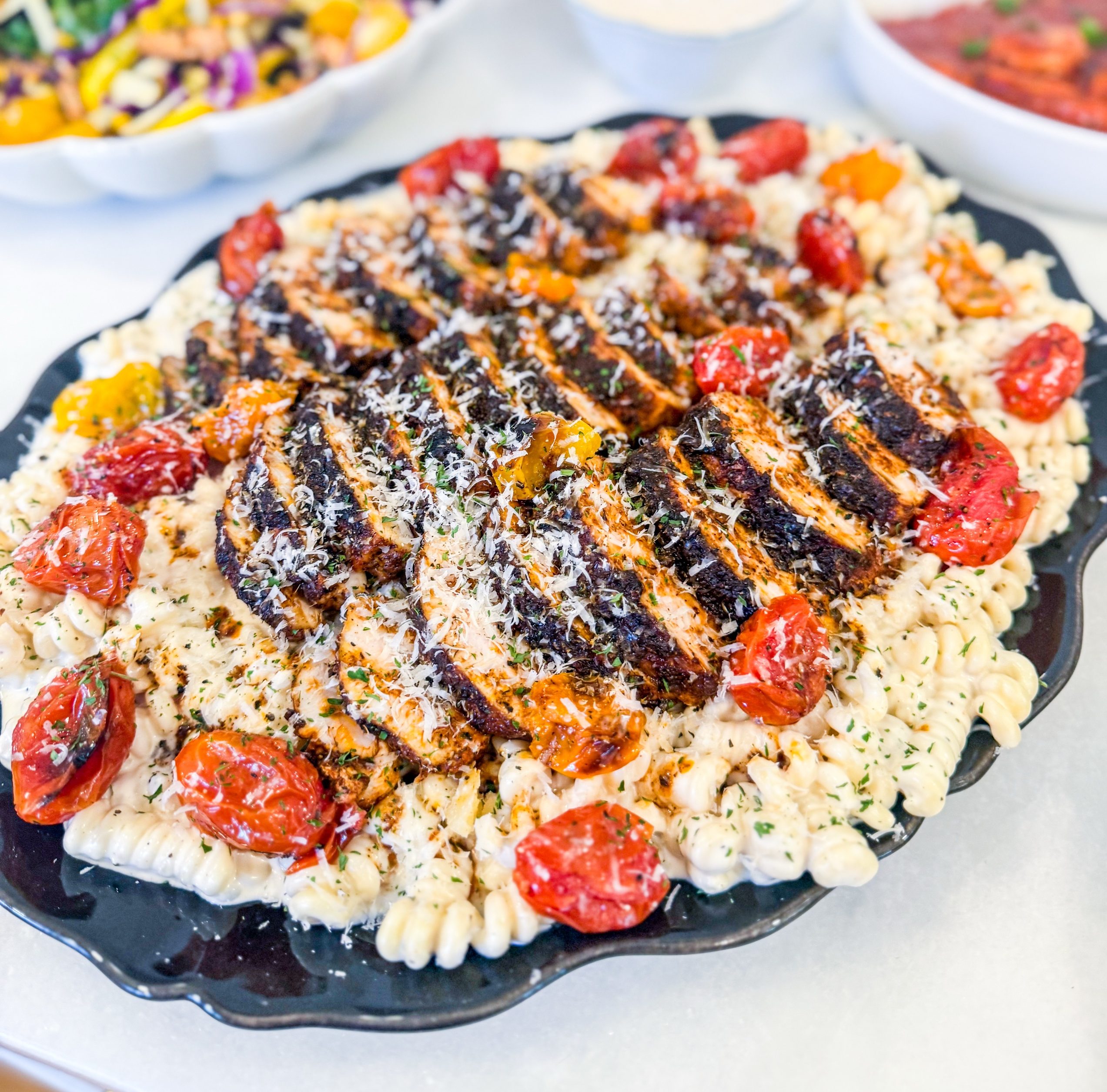 Frozen Blackened Cajun Chicken Rotini - Blackened chicken breast with rotini, roasted cherry tomatoes, Parmesan, and herbs tossed in a creamy Cajun sauce