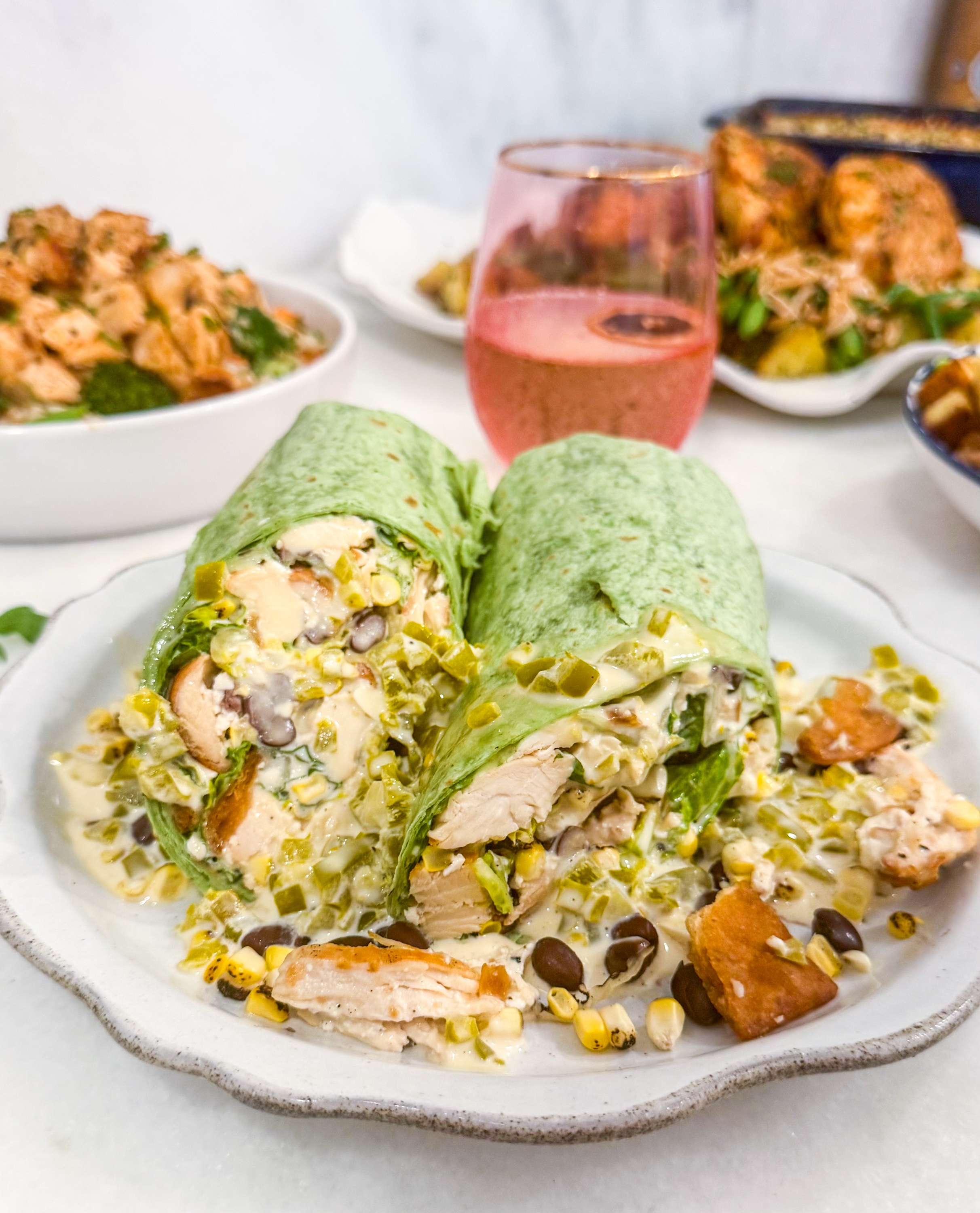 Spicy Southwest Wrap - Romaine with grilled chicken, roasted corn, black beans, tortilla strips, cotija, jalapeno Caesar dressing