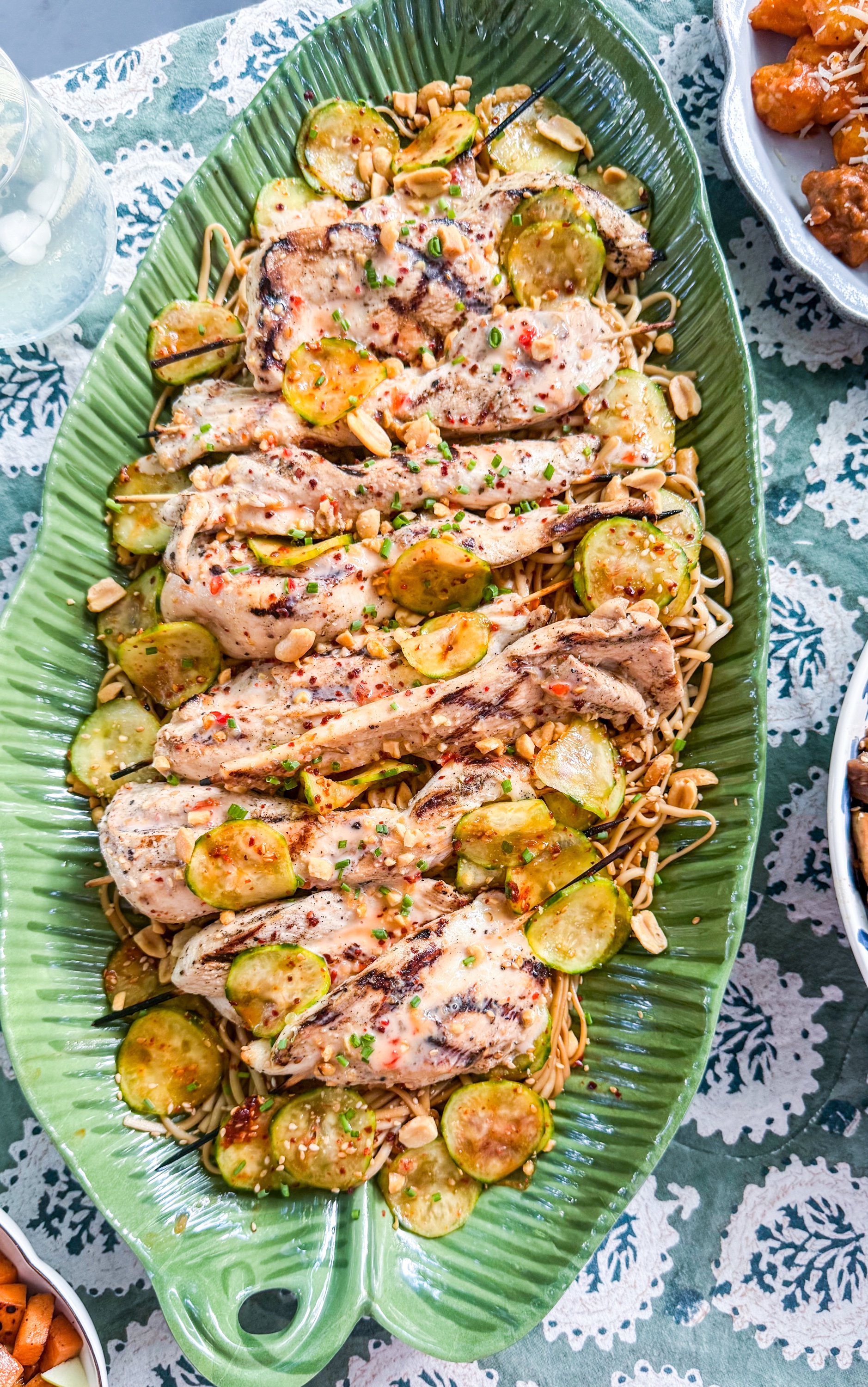 Bang Bang Chicken Skewers - Grilled chicken skewers with bang bang sauce, served with sesame peanut noodles and crunchy cucumber salad