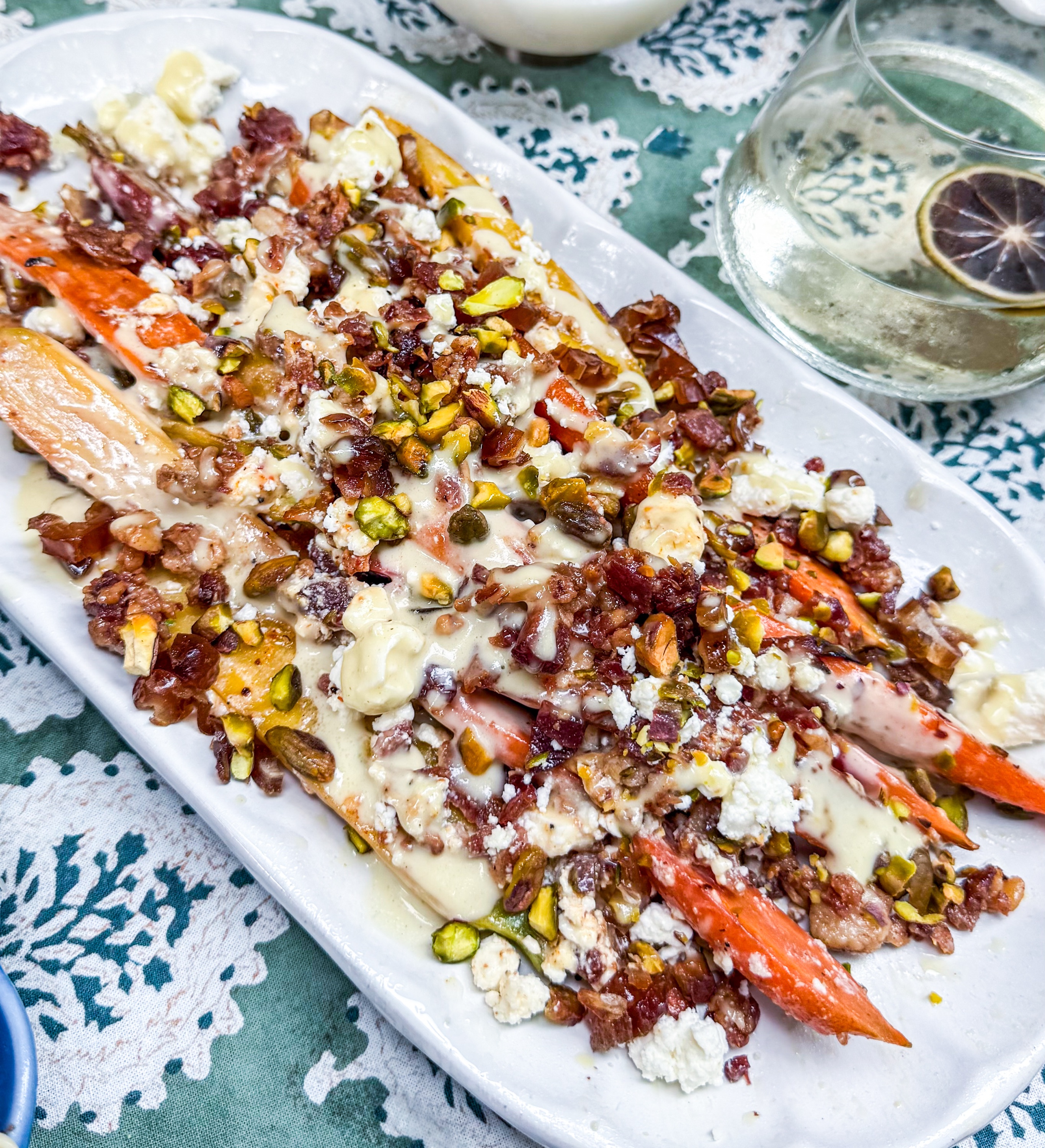 Eat Fit Spiced Carrot & Bacon Salad - Roasted carrots, bacon, dates, feta and pistachios with a spiced citrus vinaigrette