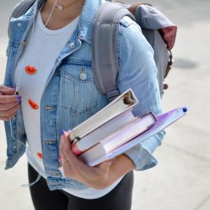 Student with books in their hand