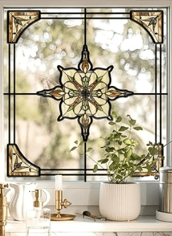 A decorative stained glass window featuring a floral design, set in a kitchen with plants and kitchenware.